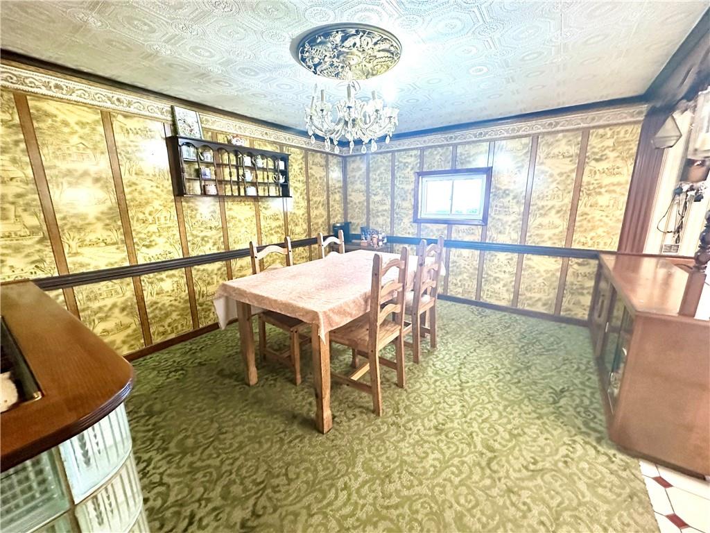 514 Southern Avenue Kittanning, PA 16201 - Photo 6 of 27 a view of a dining room with furniture a chandelier and a window
