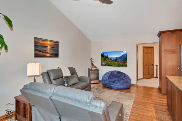 a living room with furniture and a rug