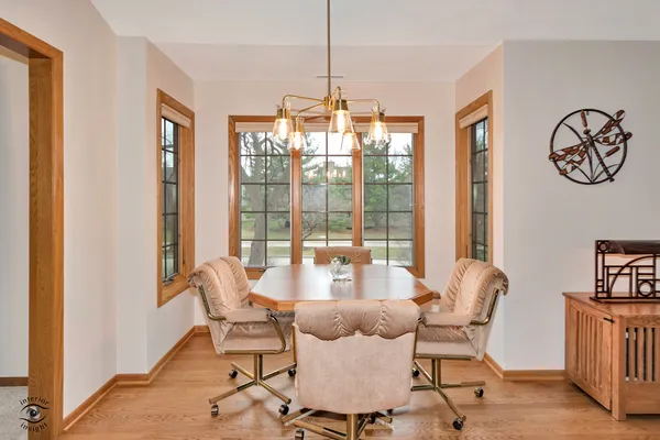 a dining room with furniture and window