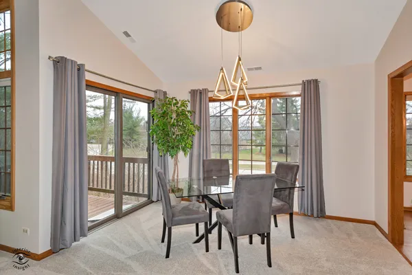 a view of a dining room with furniture window and outside view