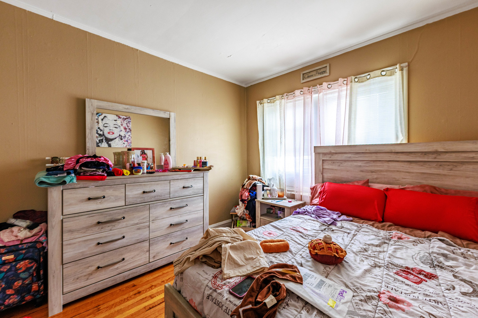 1513 West 87th Street Chicago, IL 60620 - Photo 17 of 28 a bed room with a bed and a dresser in it