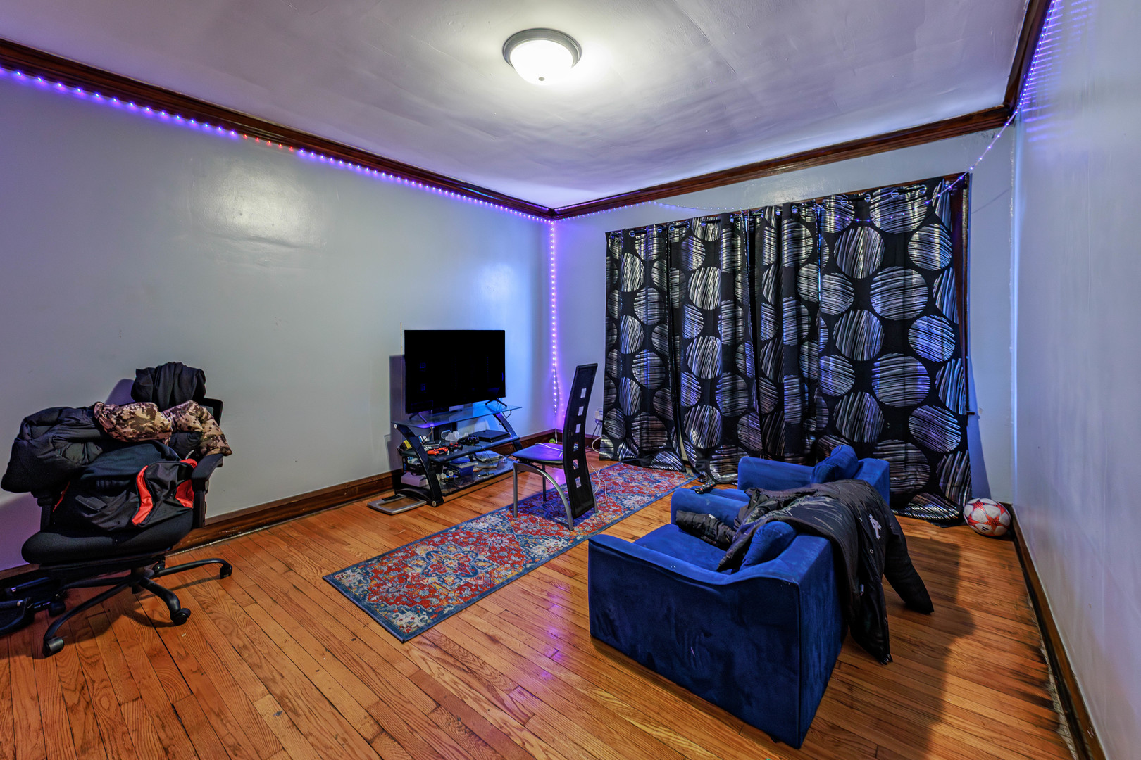 1513 West 87th Street Chicago, IL 60620 - Photo 19 of 28 a living room with furniture and a flat screen tv