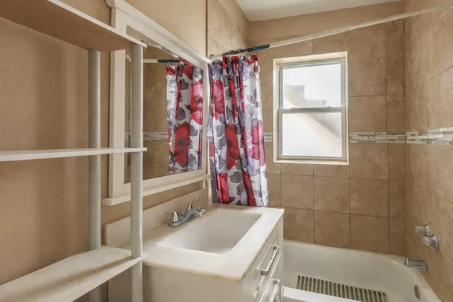 a kitchen with granite countertop stainless steel appliances a refrigerator and a sink