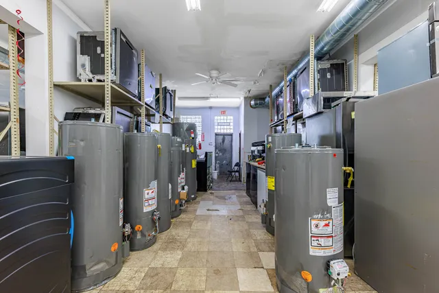 a stove top oven sitting inside of a kitchen