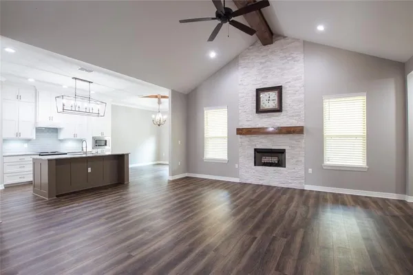 a view of kitchen and window with wooden floor