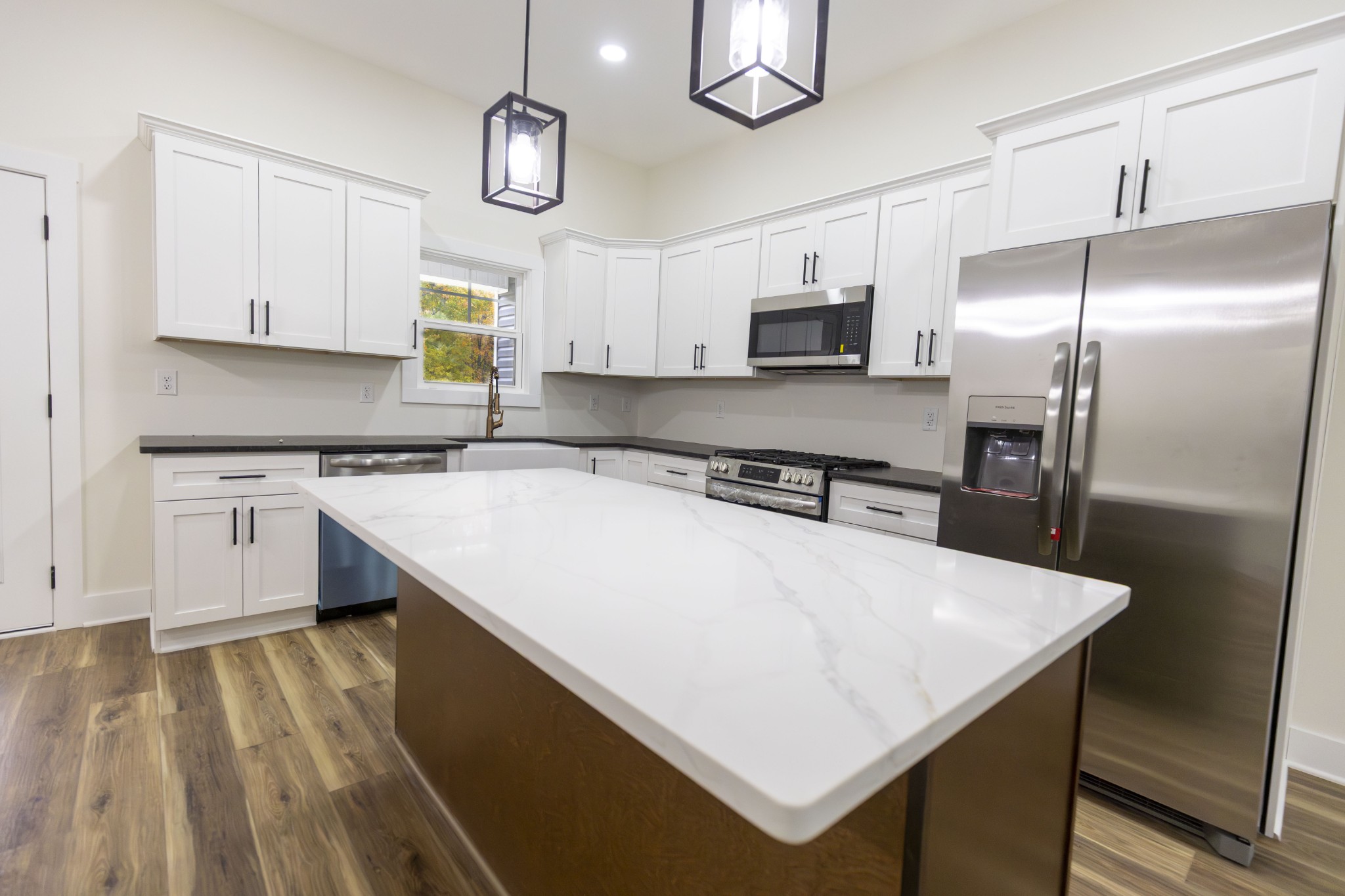 371 West Meadow Creek Road Monterey, TN 38574 - Photo 11 of 32 a kitchen with a sink a stove a refrigerator and cabinets