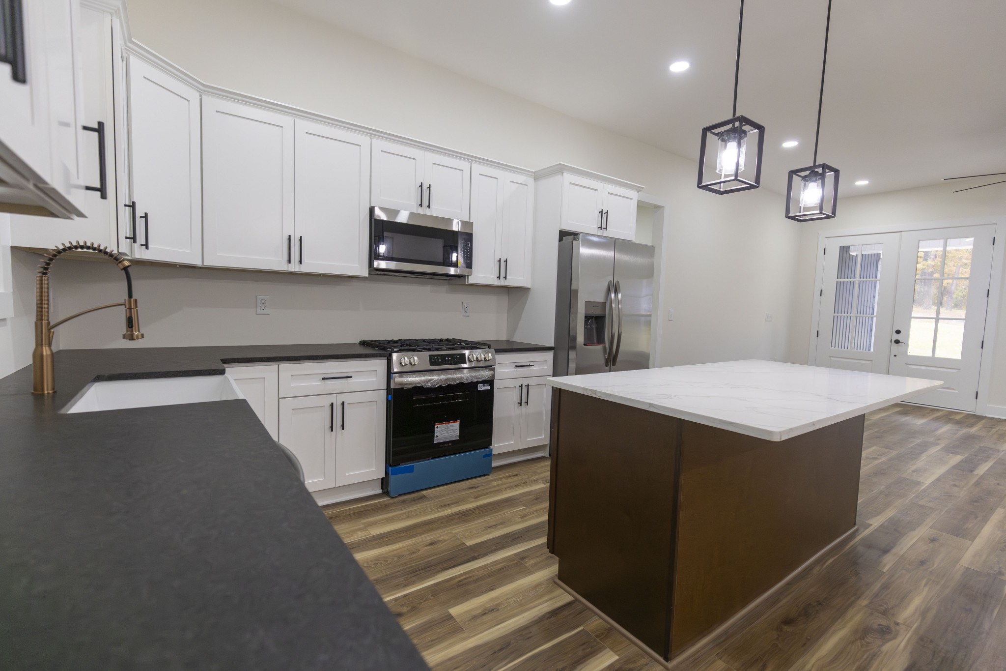 371 West Meadow Creek Road Monterey, TN 38574 - Photo 12 of 32 a kitchen with stainless steel appliances granite countertop a sink a stove and a refrigerator
