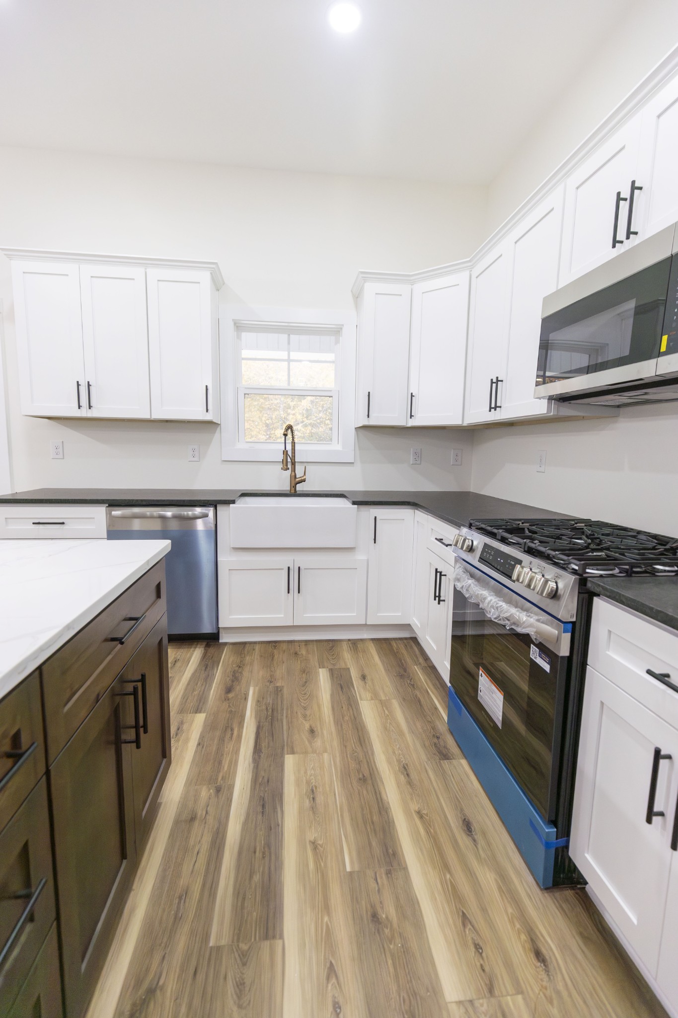 371 West Meadow Creek Road Monterey, TN 38574 - Photo 13 of 32 a kitchen with a stove a sink and a microwave