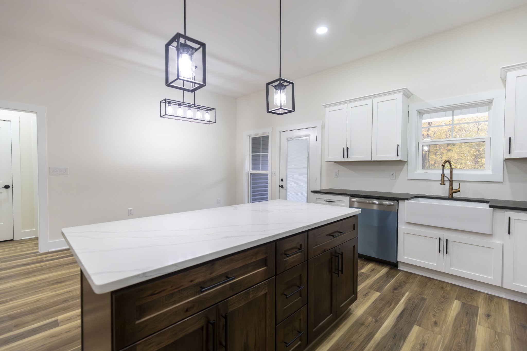 371 West Meadow Creek Road Monterey, TN 38574 - Photo 26 of 32 a kitchen with a sink cabinets and wooden floor