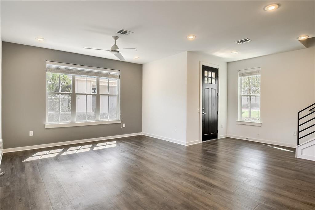 2624 Metcalfe Road, Unit 7 Austin, TX 78741 - Photo 5 of 31 Spacious interior featuring wood-finish flooring, recessed lighting, and a modern ceiling fan