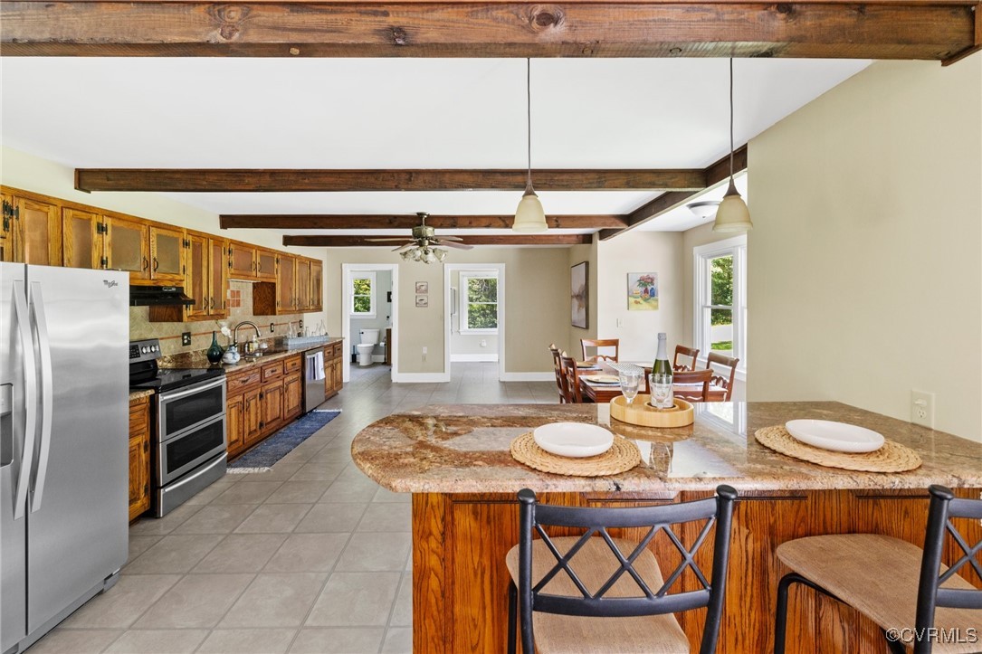 14398 Mountain Road Ashland, VA 23005 - Photo 11 of 36 a kitchen with stainless steel appliances a table and chairs