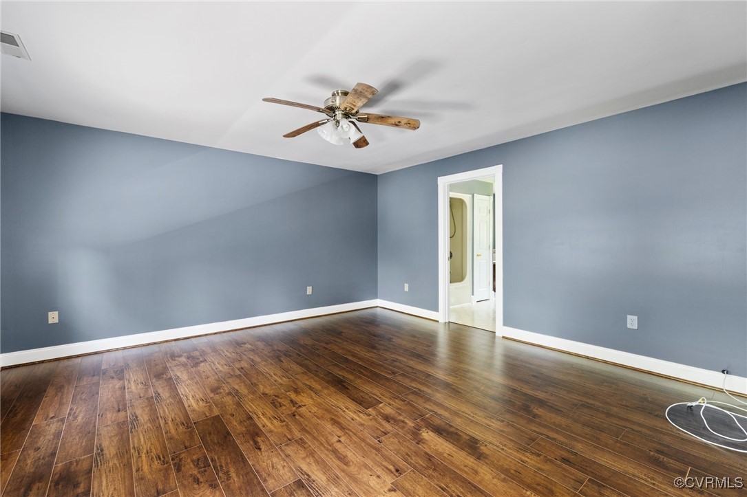 14398 Mountain Road Ashland, VA 23005 - Photo 21 of 36 a view of an empty room with window and wooden floor