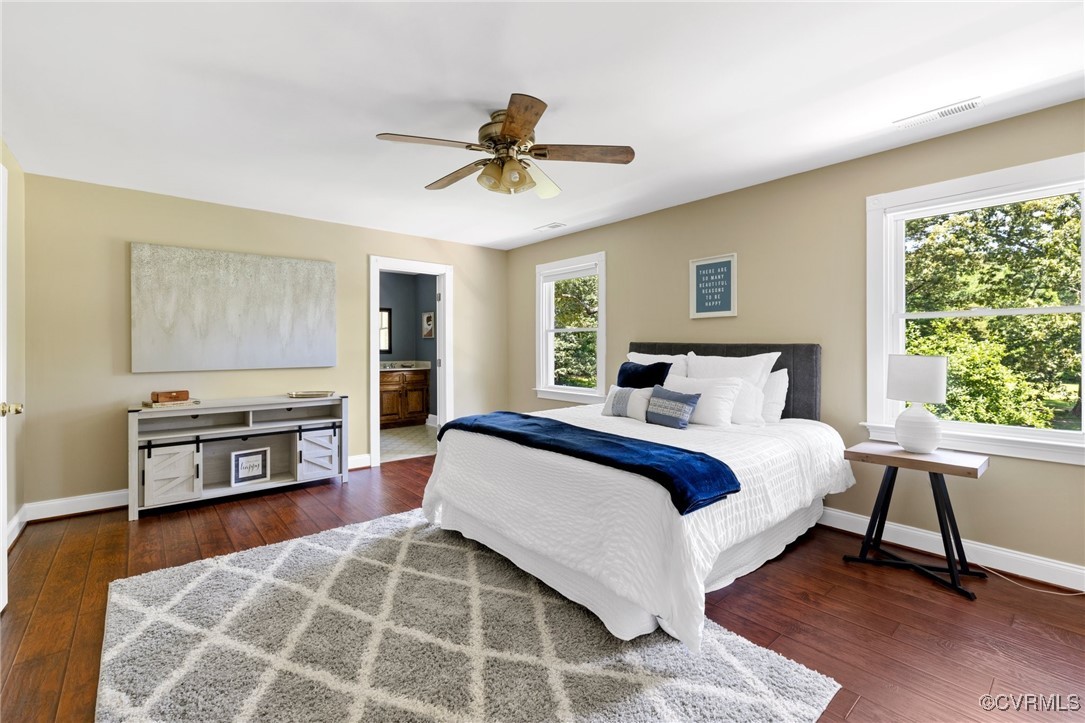 14398 Mountain Road Ashland, VA 23005 - Photo 26 of 36 a bedroom with a bed and a flat tv screen on dresser
