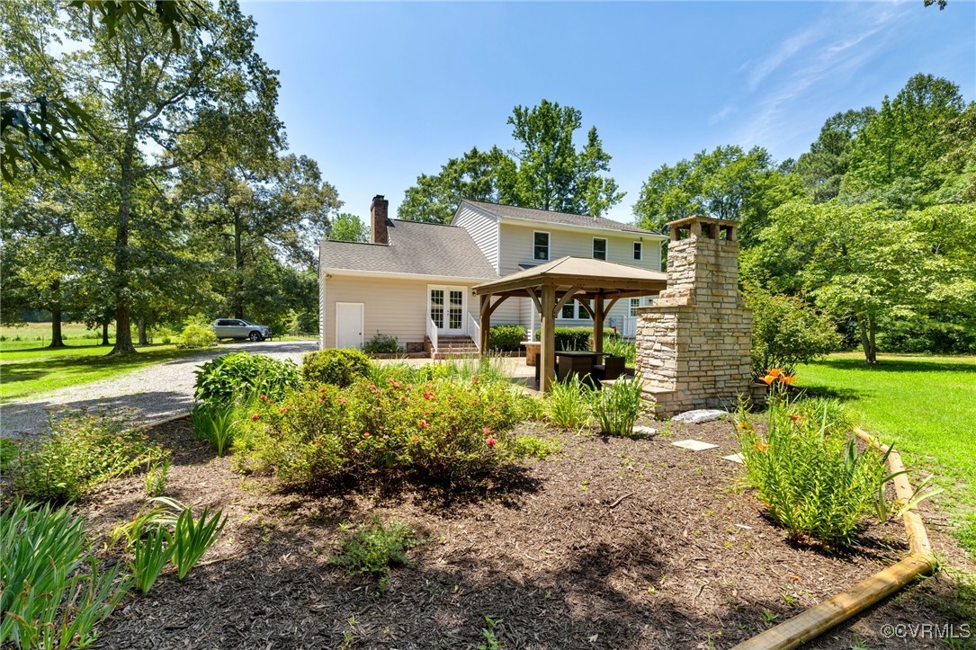 14398 Mountain Road Ashland, VA 23005 - Photo 33 of 36 a front view of a house with garden