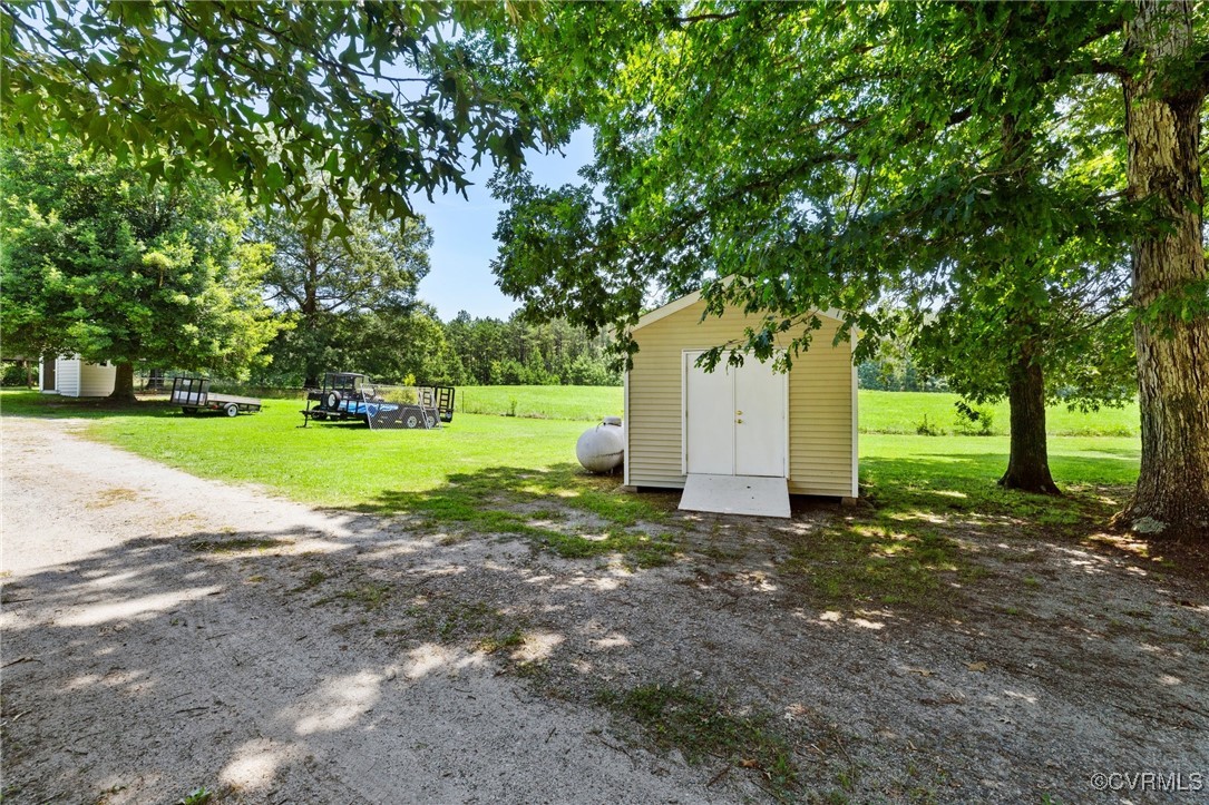 14398 Mountain Road Ashland, VA 23005 - Photo 34 of 36 a view of a house with a yard and tree