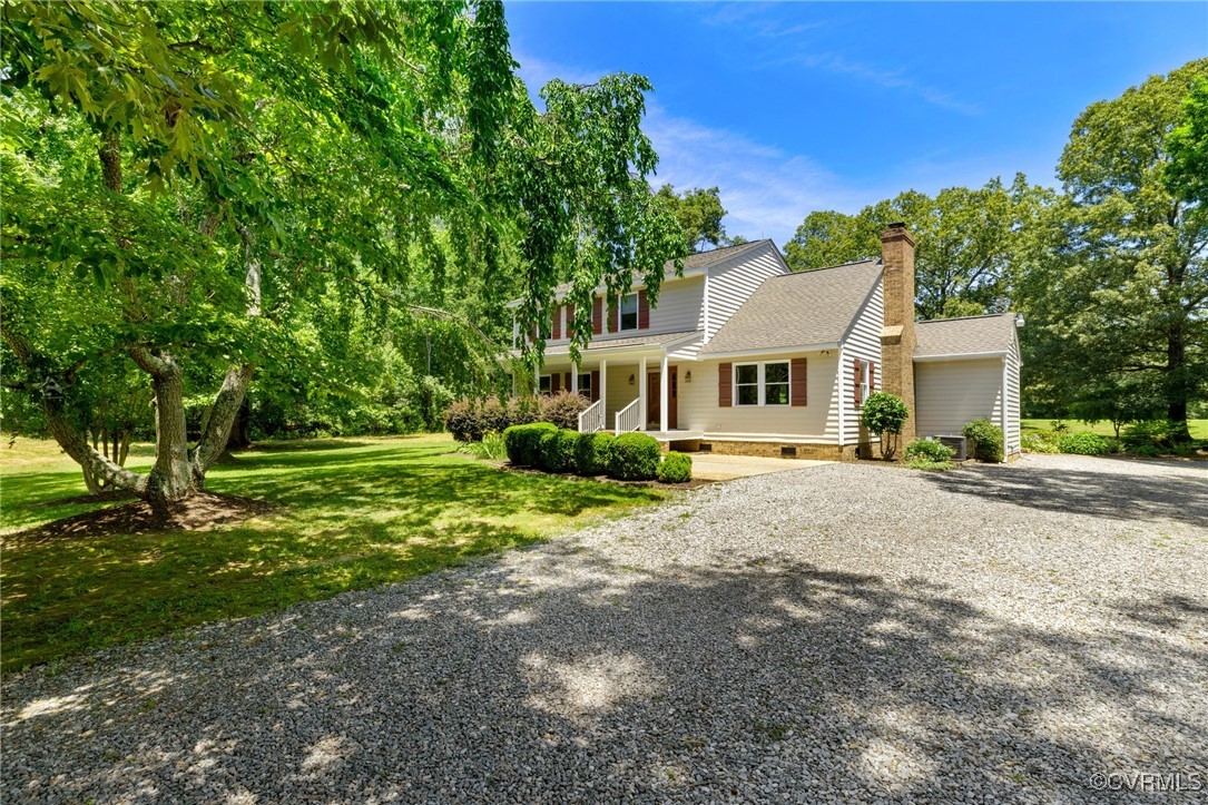14398 Mountain Road Ashland, VA 23005 - Photo 4 of 36 a front view of a house with a yard