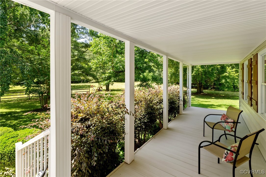 14398 Mountain Road Ashland, VA 23005 - Photo 6 of 36 a view of a porch with furniture and garden