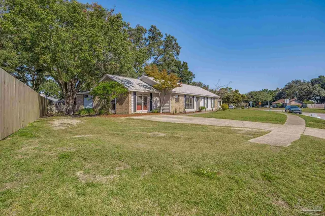 a spacious bedroom with a bed and a walk in closet