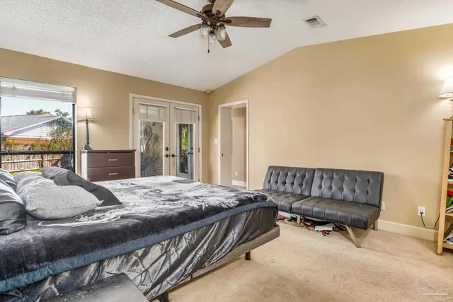 en empty room with windows and fan