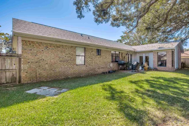 an aerial view of a house with a swimming pool