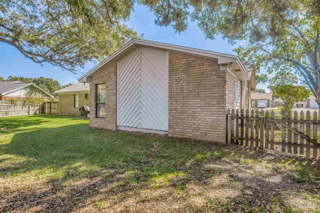 an aerial view of a house with a garden