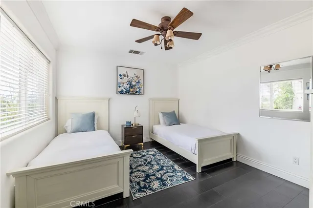 a kitchen with stainless steel appliances kitchen island granite countertop a stove a sink and a refrigerator