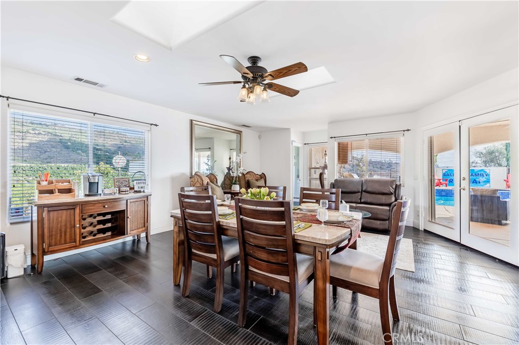 20491 Carancho Road Temecula, CA 92590 - Photo 16 of 64 a view of a dining room with furniture window and wooden floor