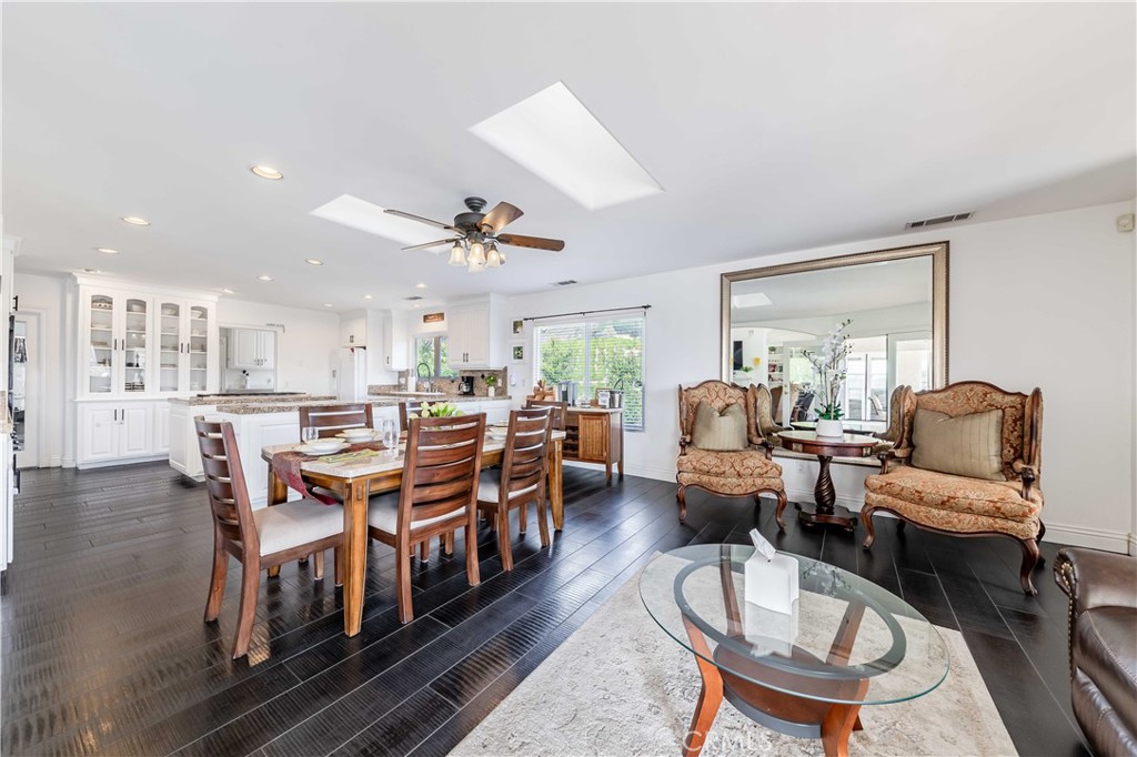 20491 Carancho Road Temecula, CA 92590 - Photo 17 of 64 a living room with lots of furniture a rug kitchen view and a large window