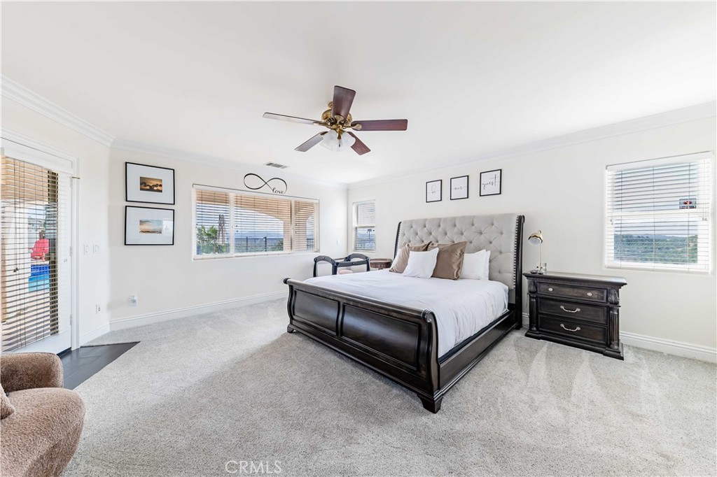 20491 Carancho Road Temecula, CA 92590 - Photo 21 of 64 a spacious bedroom with a bed and a window