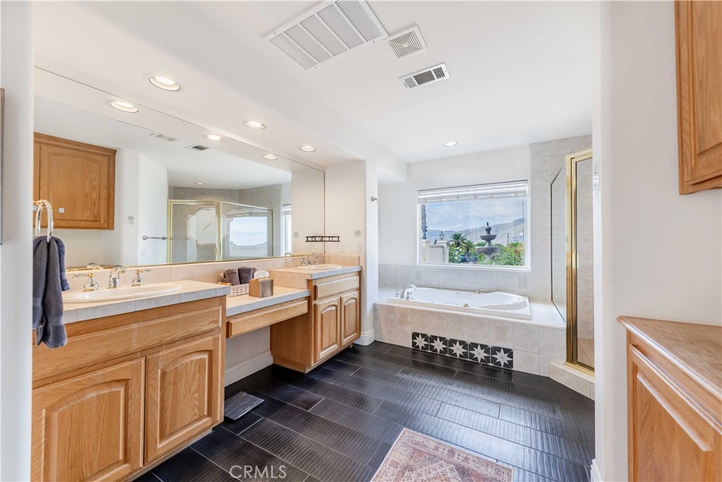 20491 Carancho Road Temecula, CA 92590 - Photo 23 of 64 a large room with lots of counter space and painting on the wall