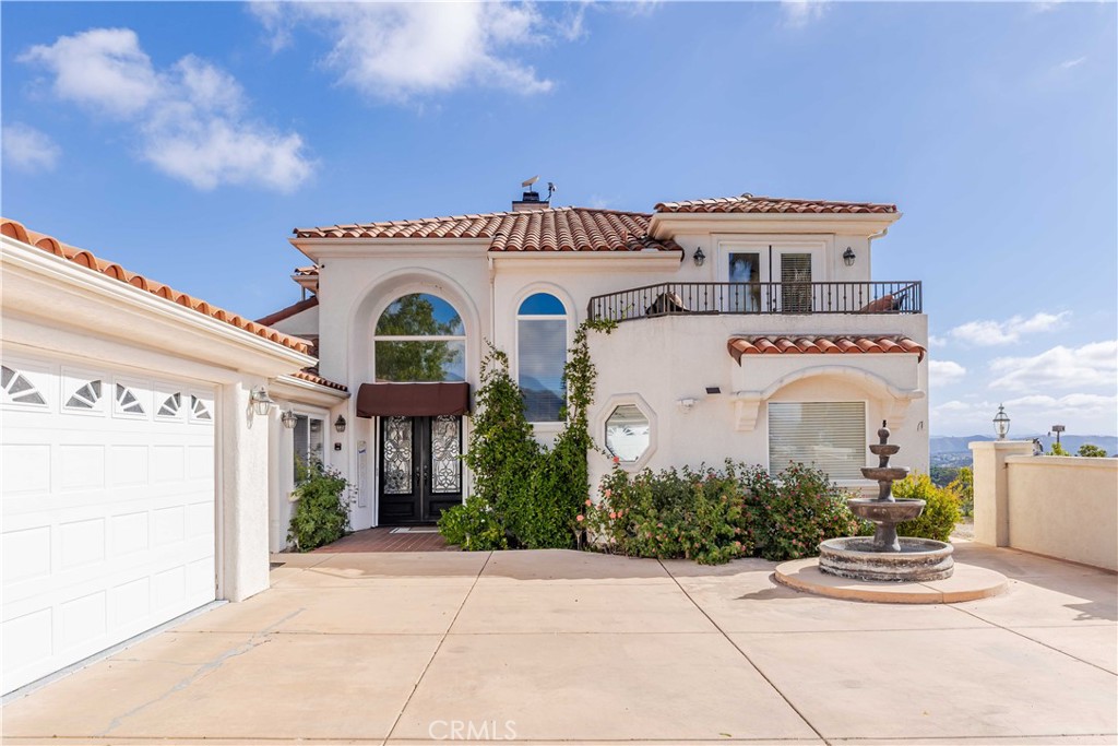 20491 Carancho Road Temecula, CA 92590 - Photo 37 of 64 a front view of a house with garden
