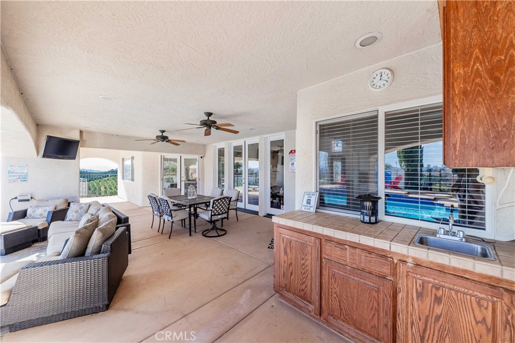 20491 Carancho Road Temecula, CA 92590 - Photo 40 of 64 a living room with furniture and a large window