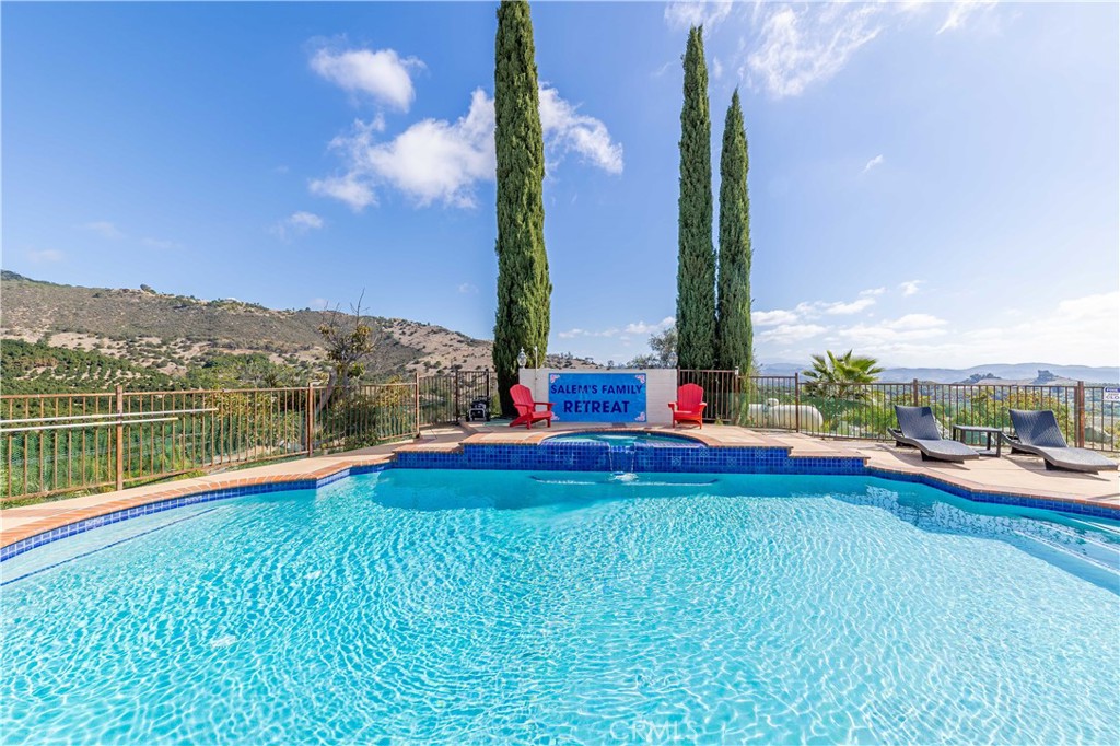 20491 Carancho Road Temecula, CA 92590 - Photo 42 of 64 a view of swimming pool with lake and mountain view