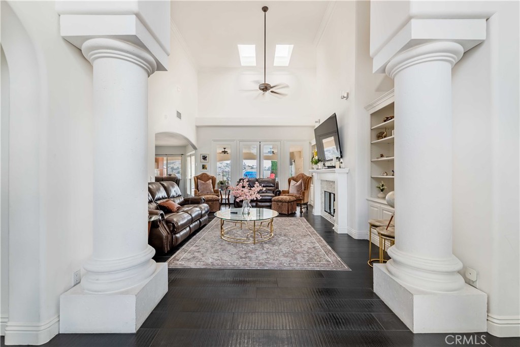 20491 Carancho Road Temecula, CA 92590 - Photo 5 of 64 a living room with furniture and a fireplace