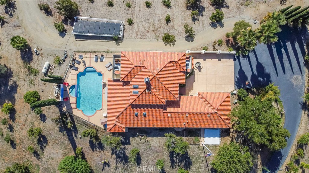 20491 Carancho Road Temecula, CA 92590 - Photo 59 of 64 an aerial view of a house with a yard and large trees