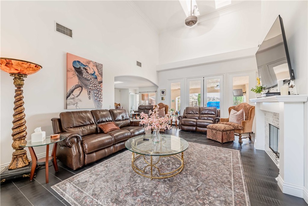 20491 Carancho Road Temecula, CA 92590 - Photo 6 of 64 a living room with furniture and a chandelier