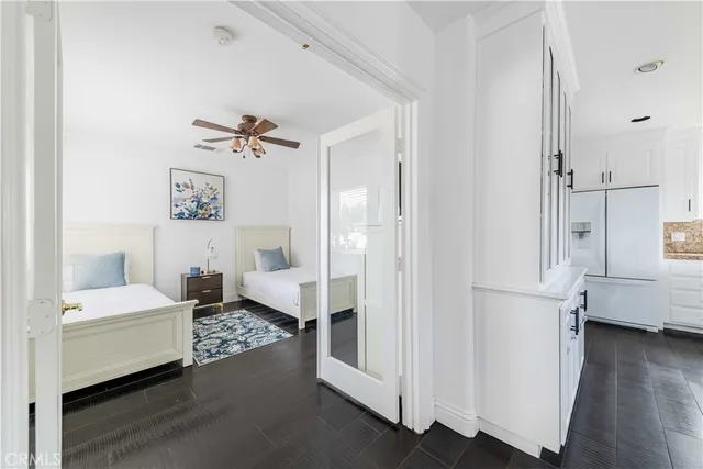 a kitchen with stove a sink and a refrigerator