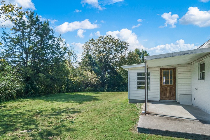 7640 Oak Grove Road Monroe, TN 38573 - Photo 23 of 31 a house view with a garden space
