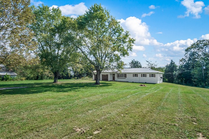 7640 Oak Grove Road Monroe, TN 38573 - Photo 27 of 31 a house view with a garden space