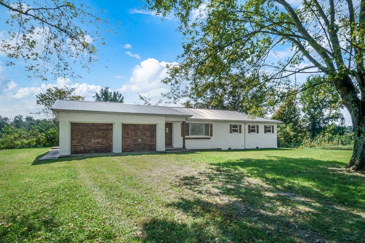 7640 Oak Grove Road Monroe, TN 38573 - Photo 29 of 31 a view of a house with a yard