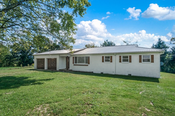 7640 Oak Grove Road Monroe, TN 38573 - Photo 31 of 31 a view of a house with a yard
