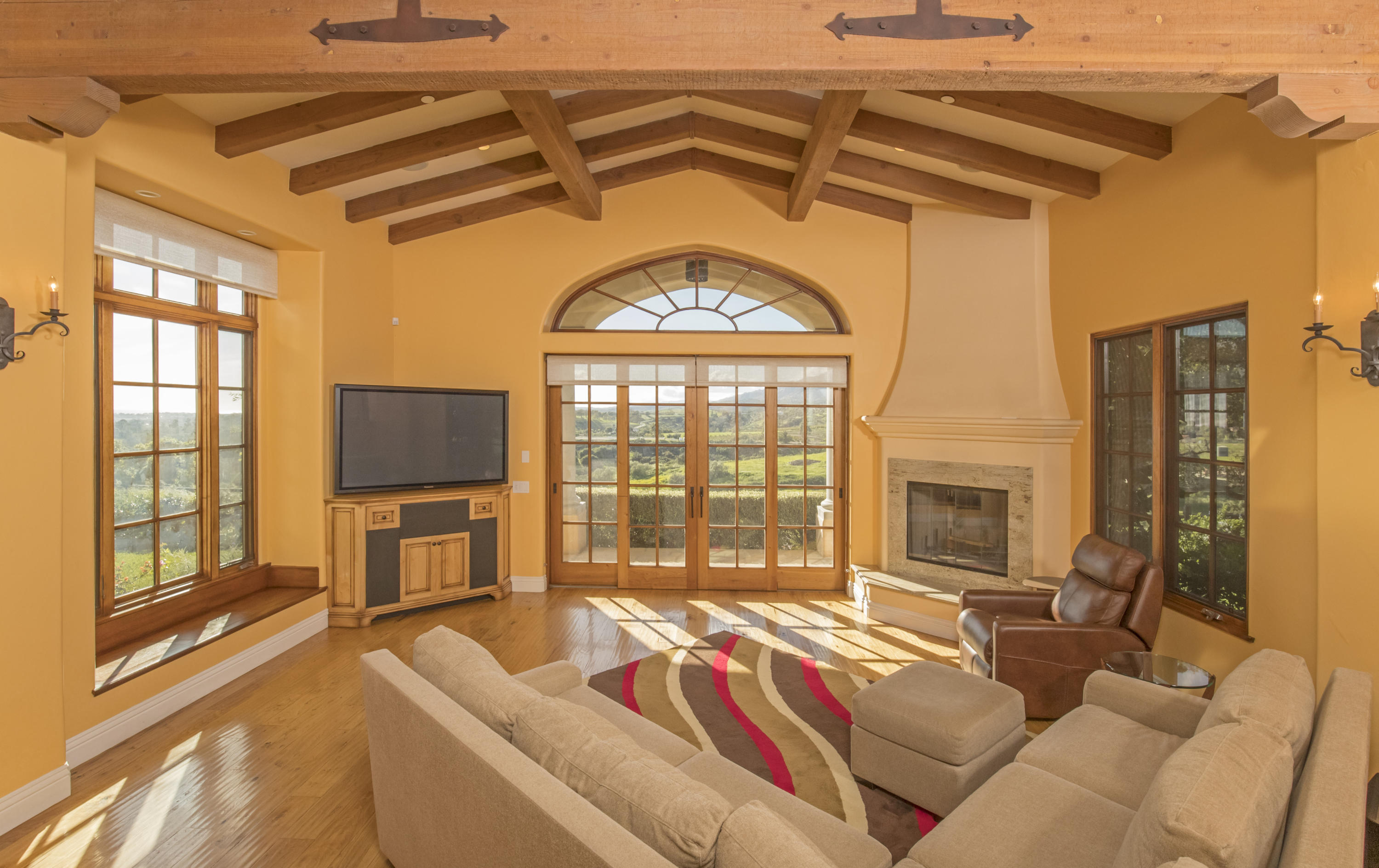 1368 Via Veneto Santa Barbara, CA 93111 - Photo 6 of 21 a living room with furniture a flat screen tv and a large window