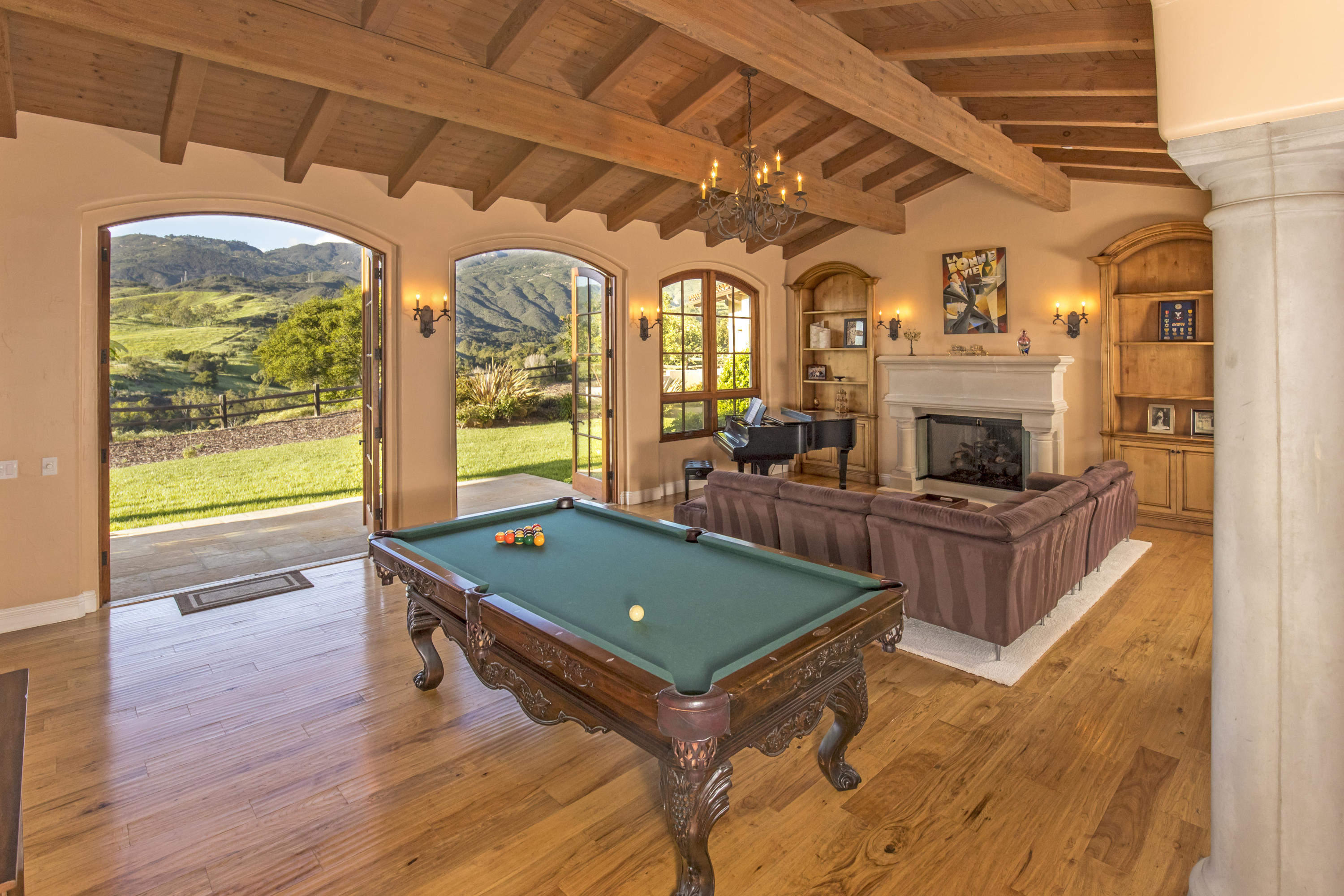 1368 Via Veneto Santa Barbara, CA 93111 - Photo 8 of 21 a living room with furniture a flat screen tv and a fireplace