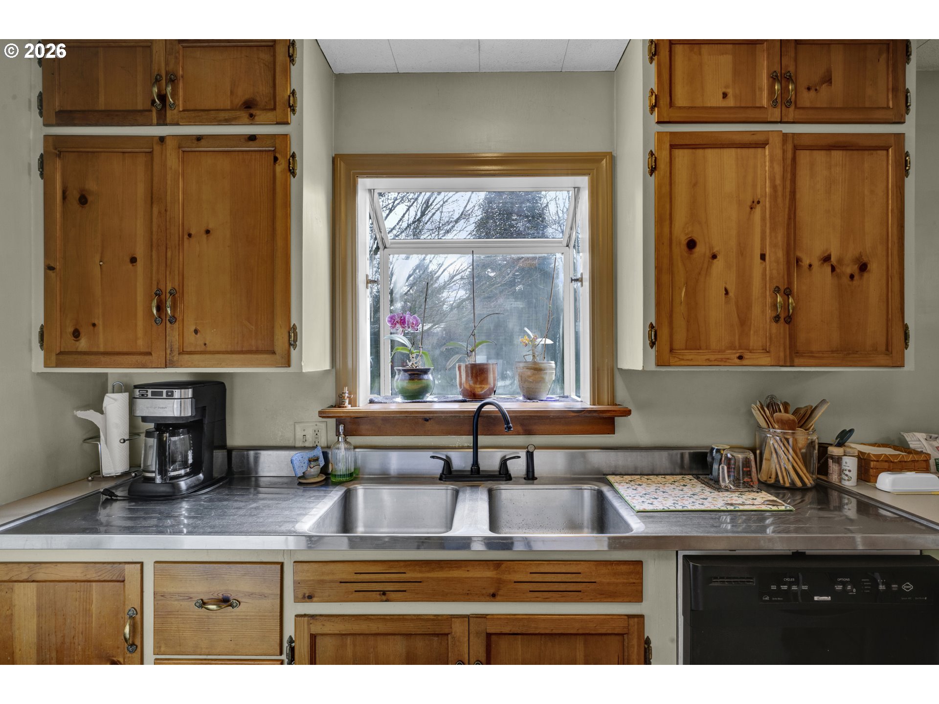 780 Cherry Avenue Eugene, OR 97404 - Photo 11 of 29 a kitchen with kitchen island a sink a stove and a window