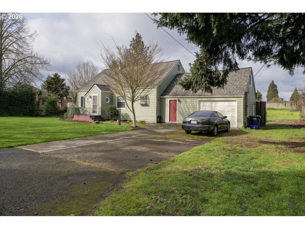 780 Cherry Avenue Eugene, OR 97404 - Photo 2 of 29 a car parked in front of white house