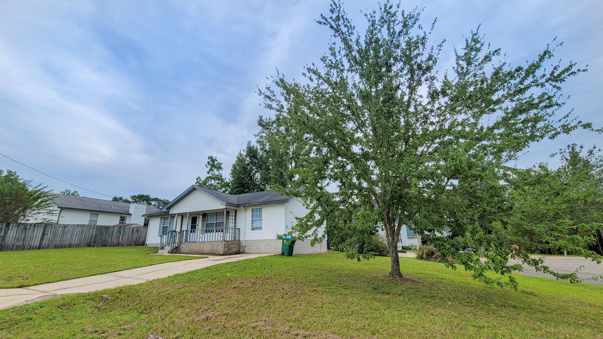 329 Ray Avenue Crestview, FL 32536 - Photo 3 of 14 a front view of a house with a yard and garage