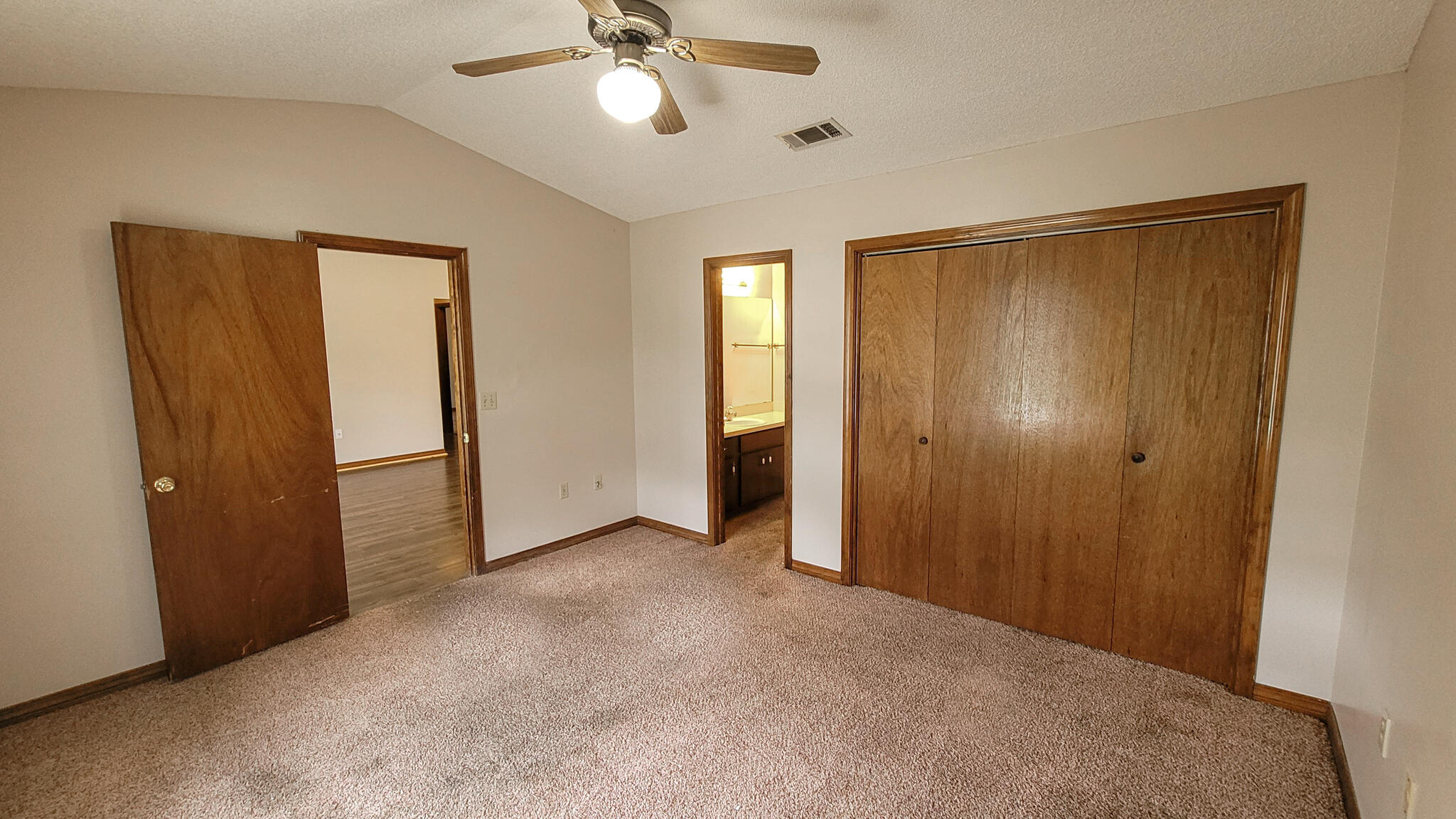 329 Ray Avenue Crestview, FL 32536 - Photo 7 of 14 an empty room with closet and a chandelier fan