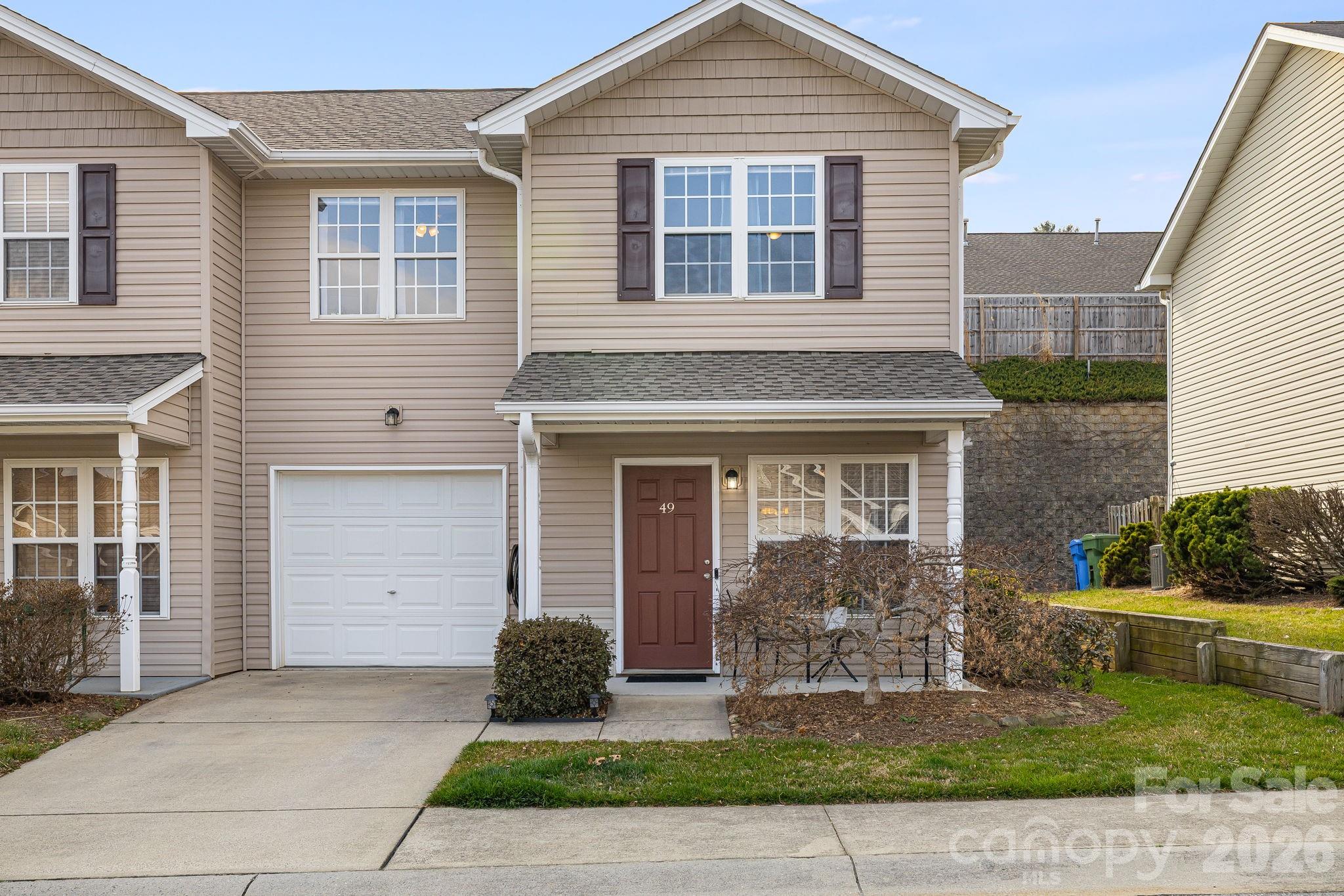 49 Farington Circle Fletcher, NC 28732 - Photo 1 of 32 a front view of a house with garden