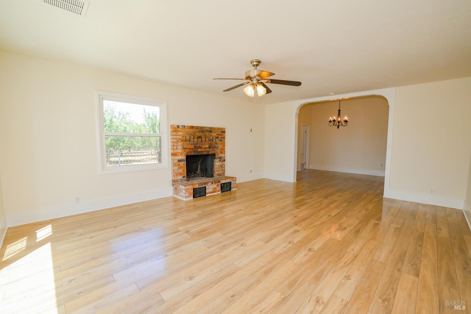 7948 North Meridian Road Dixon, CA 95620 - Photo 18 of 59 a view of livingroom with hardwood floor and a ceiling fan