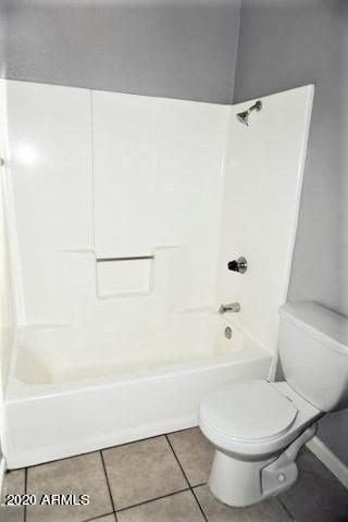 18202 North Cave Creek Road, Unit 231 Phoenix, AZ 85032 - Photo 11 of 18 a bathroom with a toilet and a bathtub